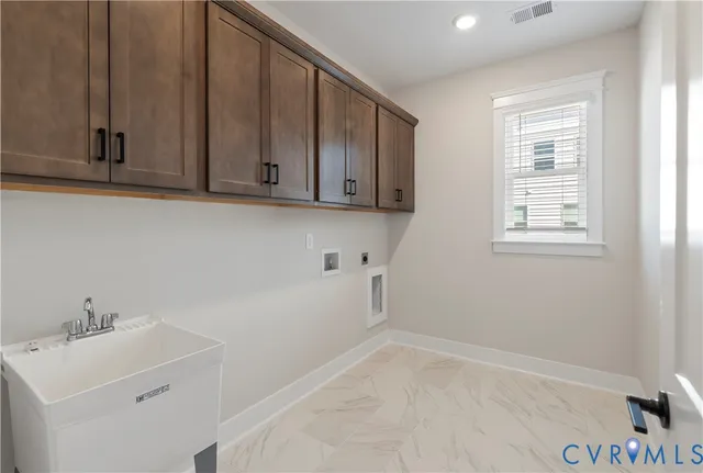a view of a storage and utility room with window