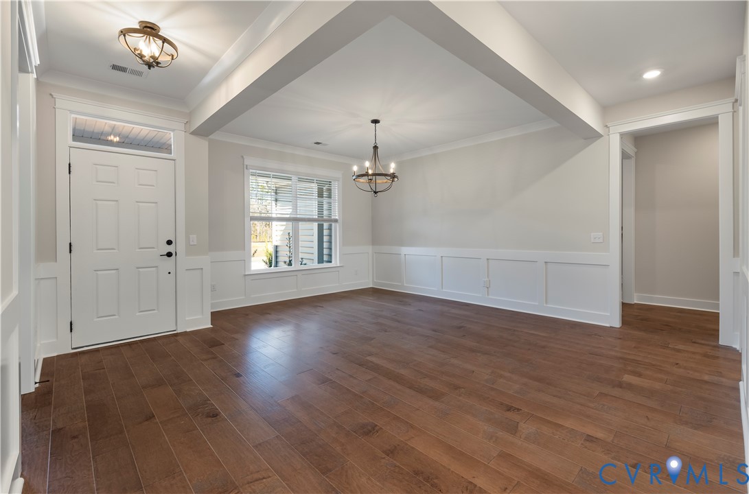 3708 Rocketts Rdg Drive Goochland, VA 23063 - Photo 3 of 29 an empty room with wooden floor chandelier and windows