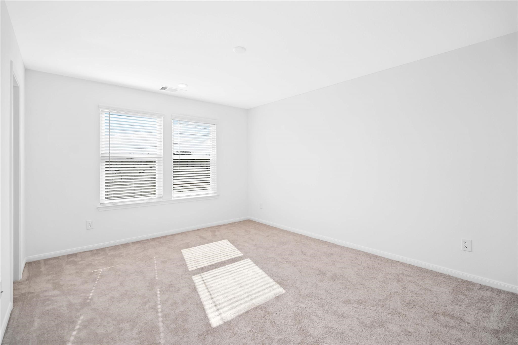 7327 Madison Commons Lane Houston, TX 77075 - Photo 3 of 6 an empty room with windows