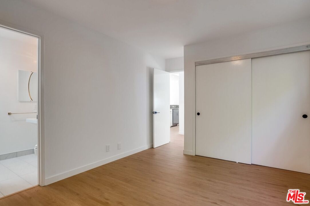 18241 Coastline Drive, Unit 2 Malibu, CA 90265 - Photo 22 of 45 a view of an empty room with wooden floor