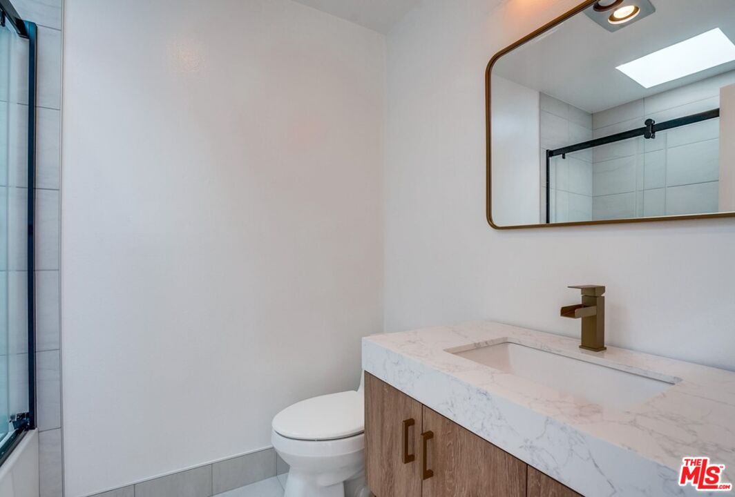 18241 Coastline Drive, Unit 2 Malibu, CA 90265 - Photo 29 of 45 a bathroom with a sink and a toilet
