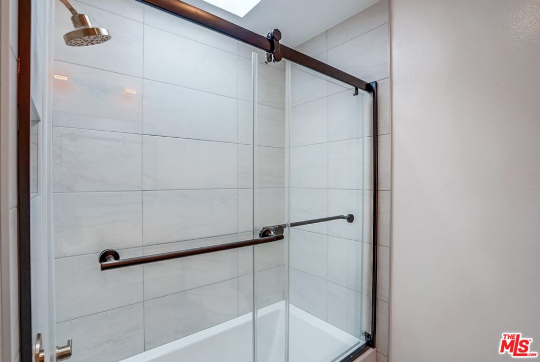 18241 Coastline Drive, Unit 2 Malibu, CA 90265 - Photo 30 of 45 a bathroom with a shower