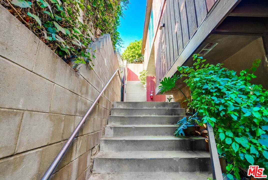 18241 Coastline Drive, Unit 2 Malibu, CA 90265 - Photo 3 of 45 a view of entryway with flower plants