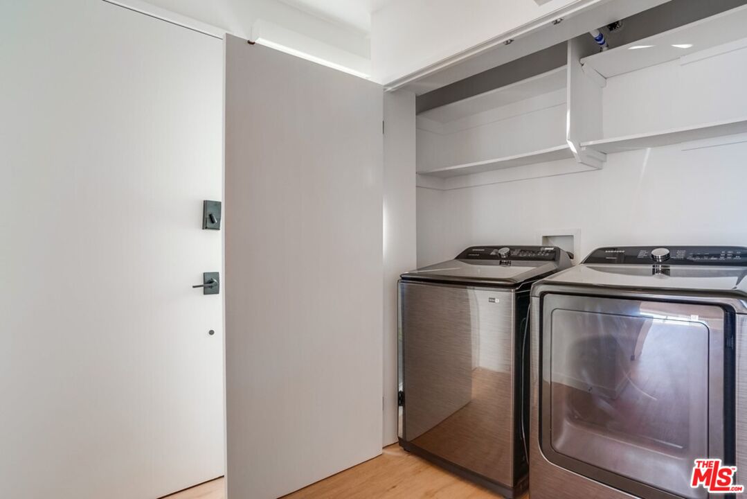18241 Coastline Drive, Unit 2 Malibu, CA 90265 - Photo 32 of 45 a utility room with washer and dryer