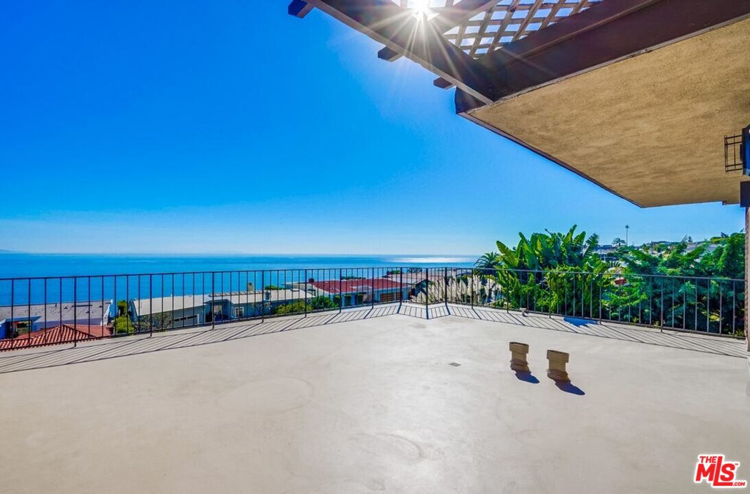 18241 Coastline Drive, Unit 2 Malibu, CA 90265 - Photo 33 of 45 a view of a swimming pool with an outdoor seating area