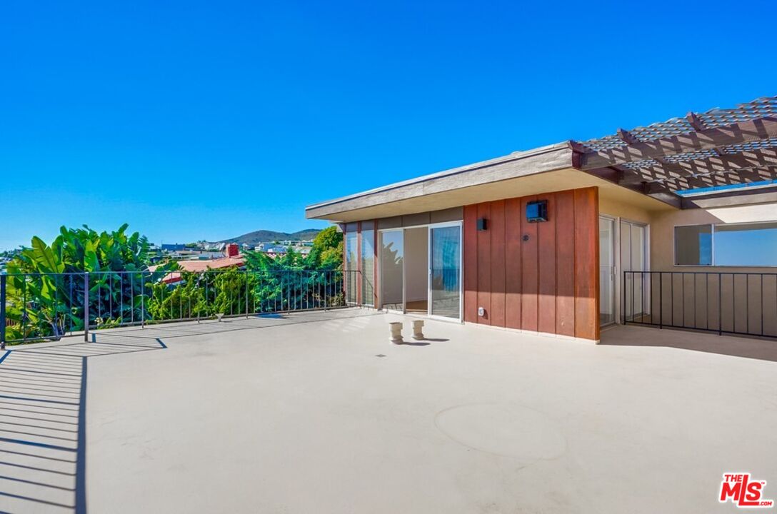 18241 Coastline Drive, Unit 2 Malibu, CA 90265 - Photo 35 of 45 a view of a house with a patio