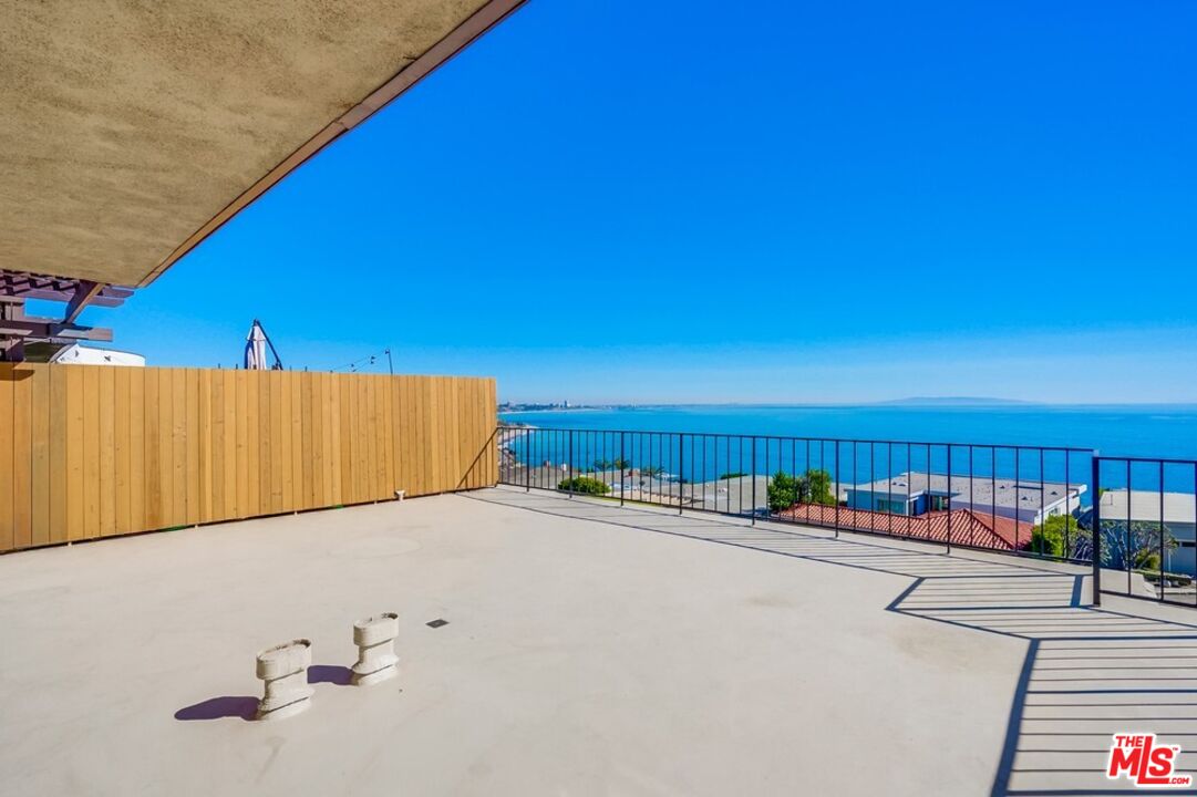 18241 Coastline Drive, Unit 2 Malibu, CA 90265 - Photo 37 of 45 a view of swimming pool and furniture