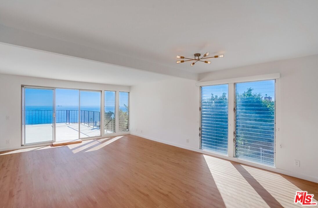 18241 Coastline Drive, Unit 2 Malibu, CA 90265 - Photo 9 of 45 a view of an empty room with a window