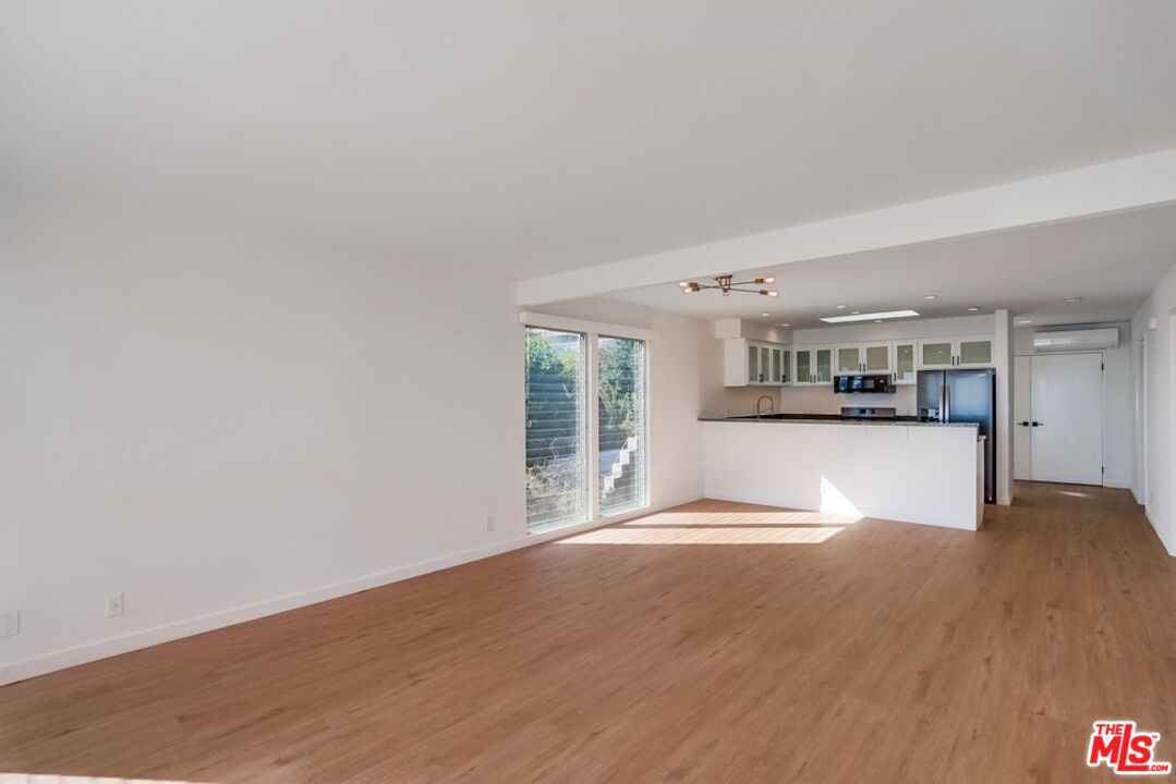 18241 Coastline Drive, Unit 2 Malibu, CA 90265 - Photo 10 of 45 a view of kitchen with refrigerator and window