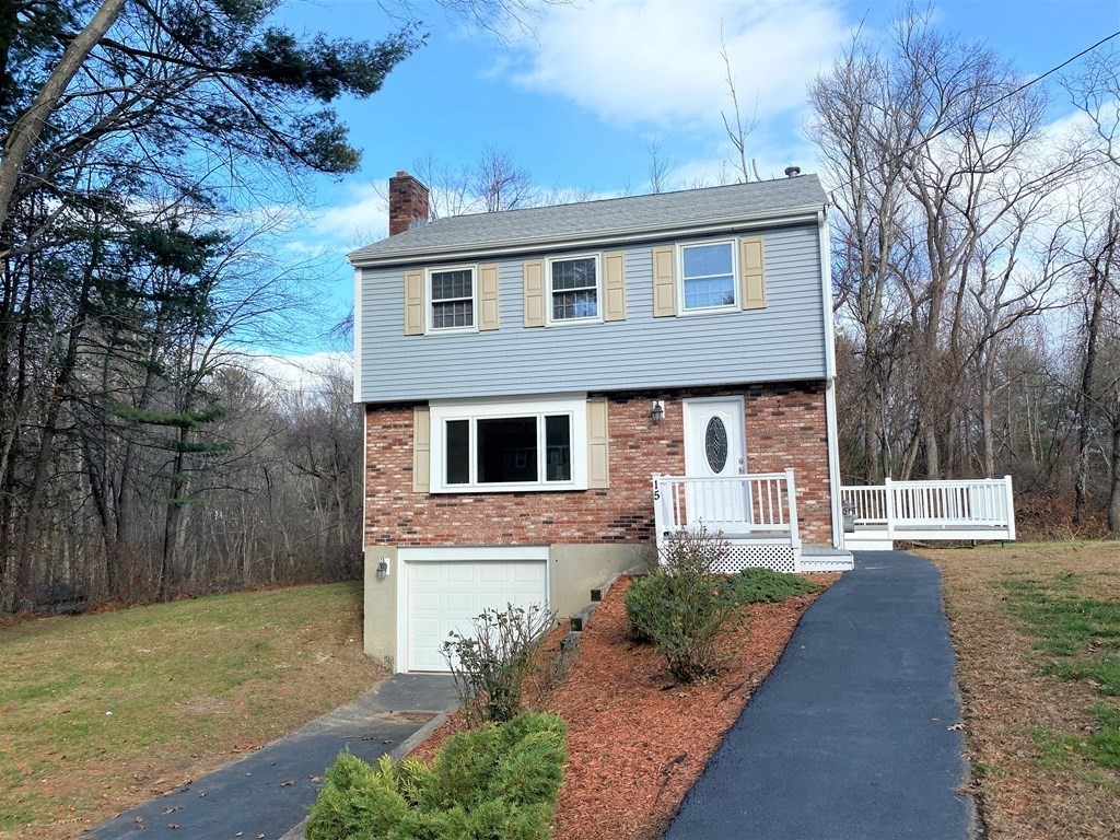 15 Appaloosa Drive, Unit 15 Methuen, MA 01844 - Photo 1 of 23 a front view of a house with garden