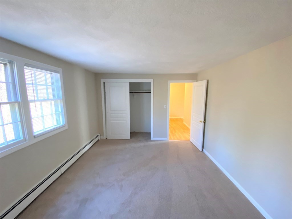 15 Appaloosa Drive, Unit 15 Methuen, MA 01844 - Photo 17 of 23 an empty room with windows