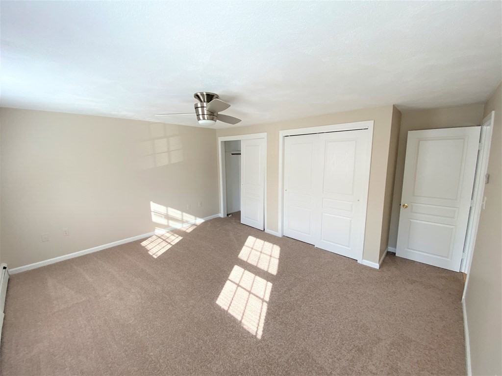 15 Appaloosa Drive, Unit 15 Methuen, MA 01844 - Photo 18 of 23 a view of an empty room with a window