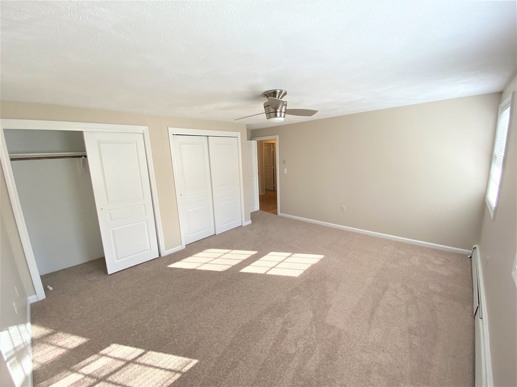 15 Appaloosa Drive, Unit 15 Methuen, MA 01844 - Photo 19 of 23 a view of empty room with wooden floor