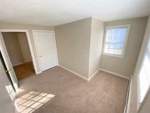 a view of walk in closet with empty tub