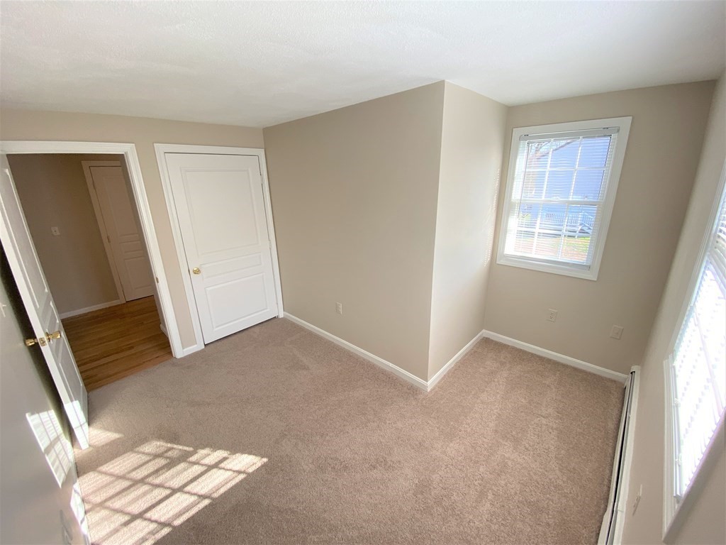 15 Appaloosa Drive, Unit 15 Methuen, MA 01844 - Photo 20 of 23 an empty room with windows