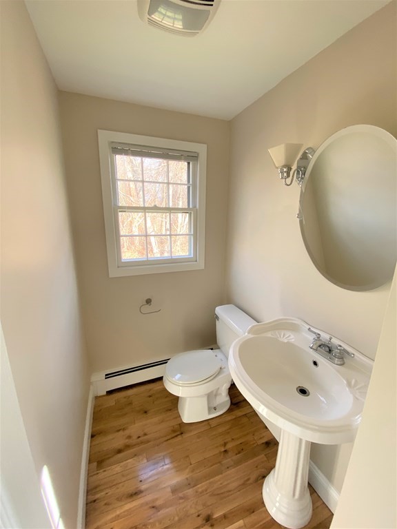 15 Appaloosa Drive, Unit 15 Methuen, MA 01844 - Photo 3 of 23 a bathroom with a sink mirror and toilet