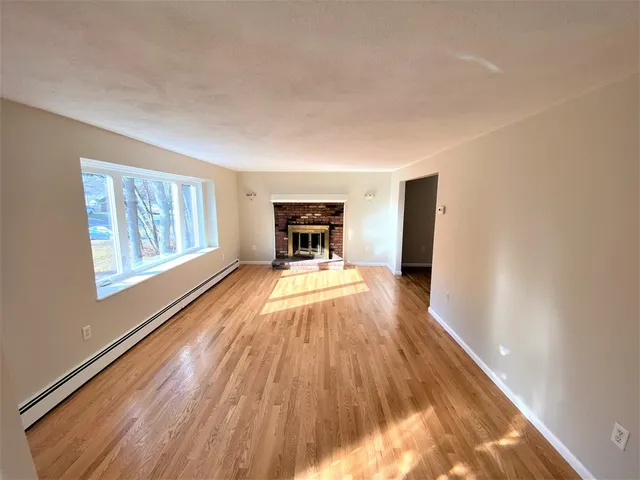 a view of a living room with a large window