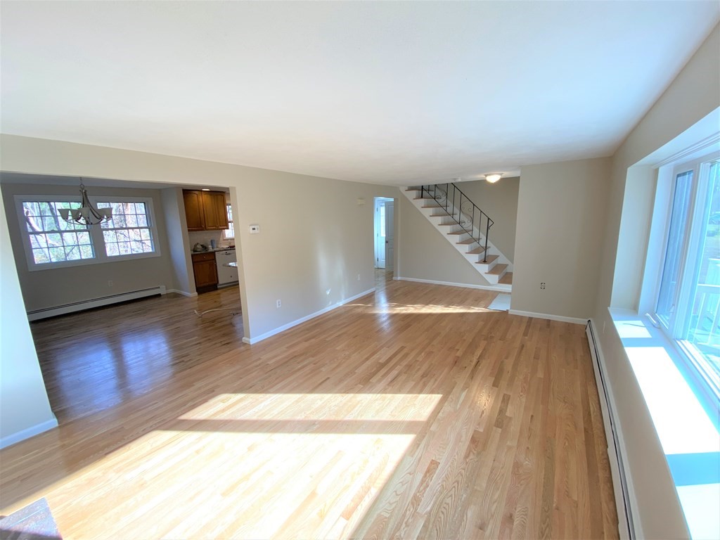 15 Appaloosa Drive, Unit 15 Methuen, MA 01844 - Photo 6 of 23 wooden floor in an empty room with a window