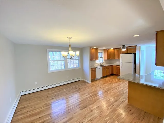 a view of a kitchen with a sink and a window