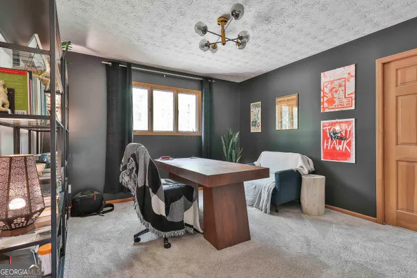 a view of a livingroom with furniture and window