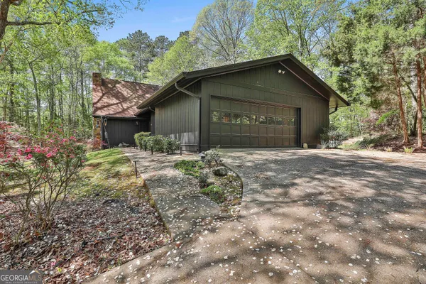 a house with trees in the background