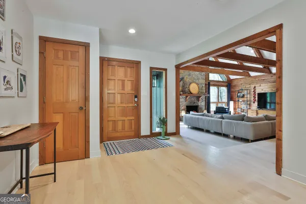 a bedroom with a large bed and a large window