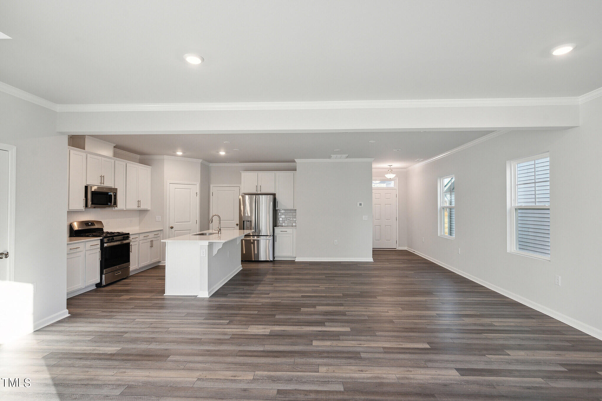 429 Lily Grv Loop Raleigh, NC 27610 - Photo 7 of 31 a view of kitchen with stove refrigerator and cabinets