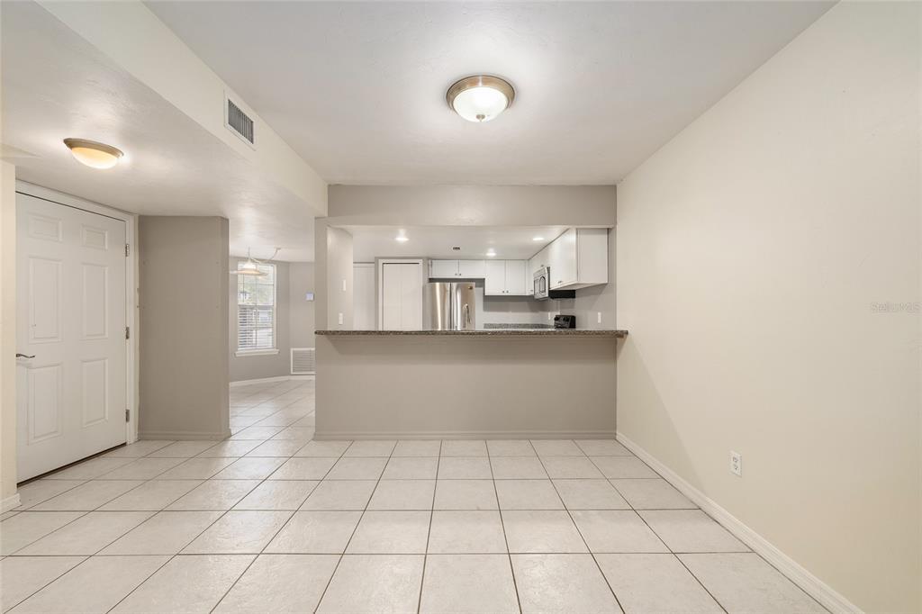 345 Northwest 48th Boulevard, Unit K Gainesville, FL 32607 - Photo 16 of 50 a view of kitchen with white cabinets