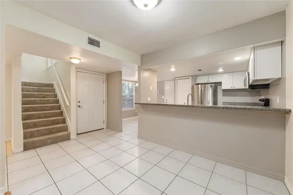 a kitchen with stainless steel appliances a sink and a stove