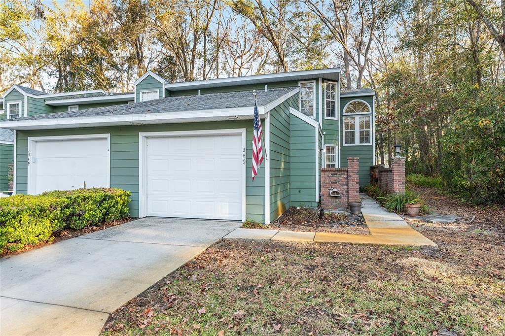 345 Northwest 48th Boulevard, Unit K Gainesville, FL 32607 - Photo 2 of 50 a view of a house with a yard