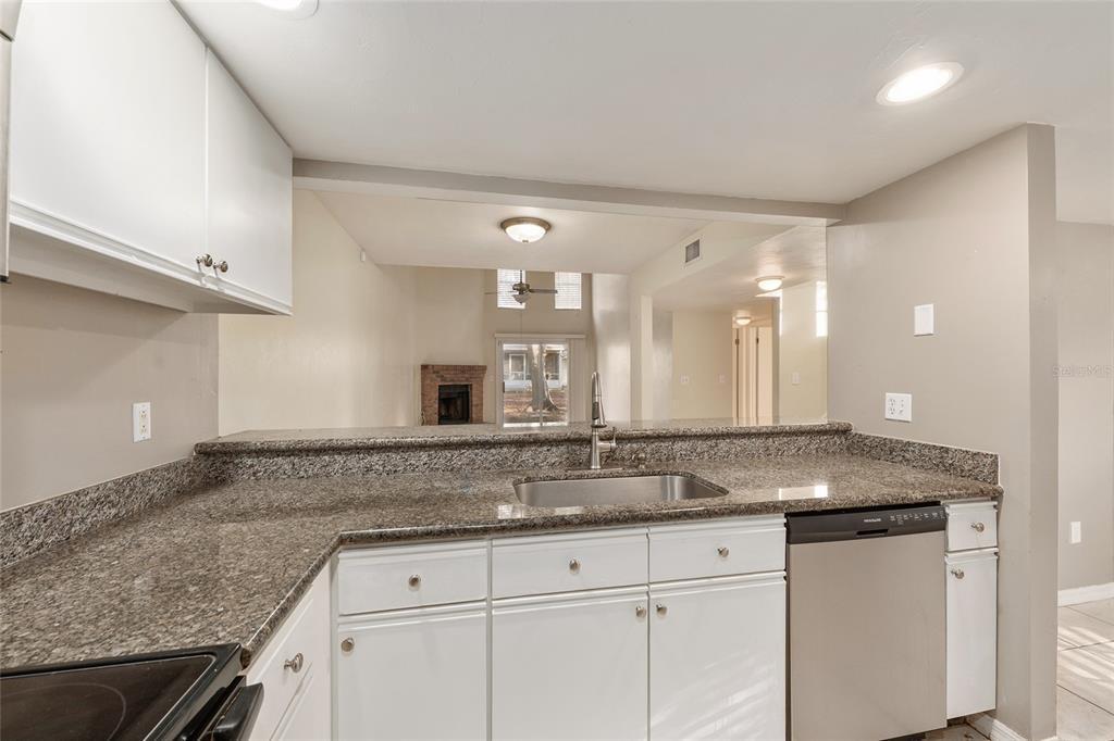 345 Northwest 48th Boulevard, Unit K Gainesville, FL 32607 - Photo 22 of 50 a view of a granite counter top and a sink