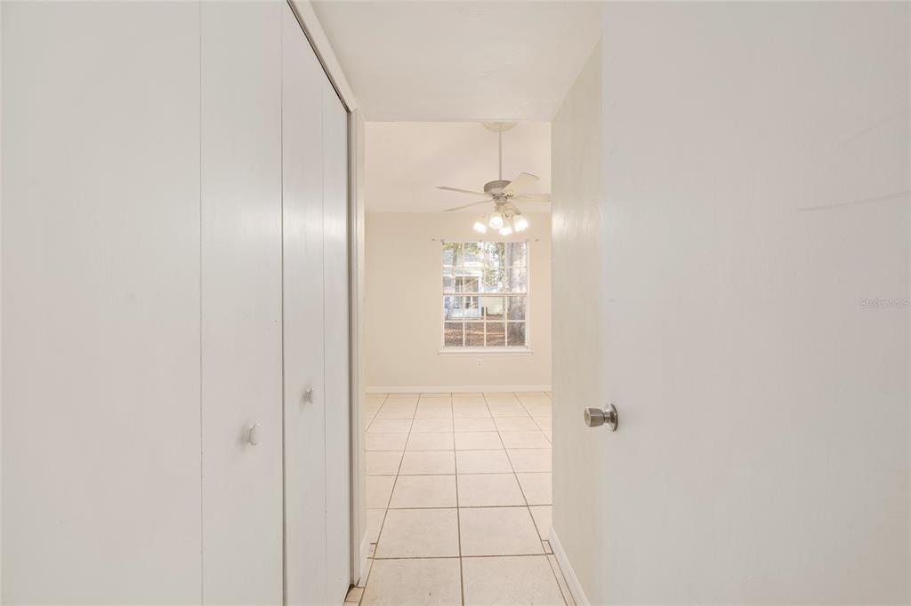 345 Northwest 48th Boulevard, Unit K Gainesville, FL 32607 - Photo 23 of 50 a view of an empty room with chandelier and a window