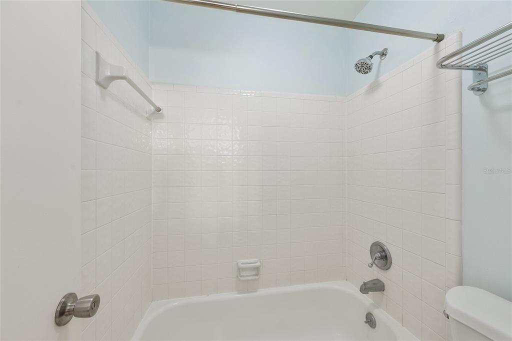 345 Northwest 48th Boulevard, Unit K Gainesville, FL 32607 - Photo 27 of 50 a bathroom with a bathtub