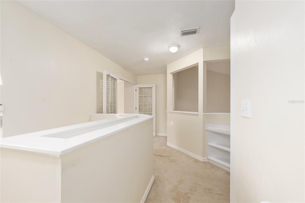 345 Northwest 48th Boulevard, Unit K Gainesville, FL 32607 - Photo 31 of 50 a view of an empty room with wooden floor