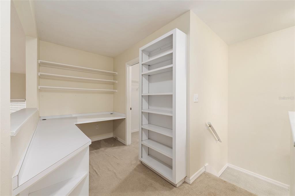 345 Northwest 48th Boulevard, Unit K Gainesville, FL 32607 - Photo 32 of 50 a view of walk in closet with empty racks