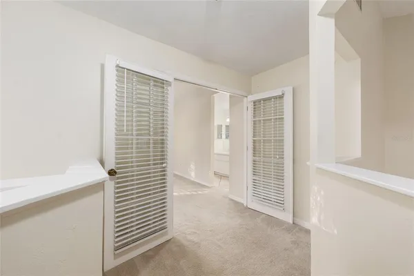 a view of walk in closet with empty racks