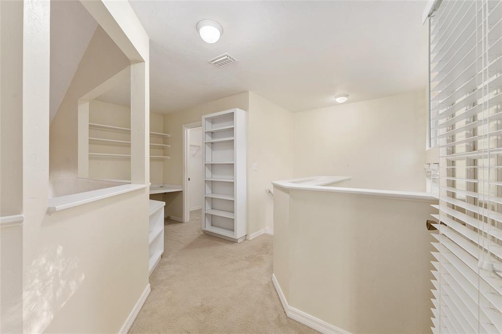 345 Northwest 48th Boulevard, Unit K Gainesville, FL 32607 - Photo 34 of 50 a view of walk in closet with empty racks