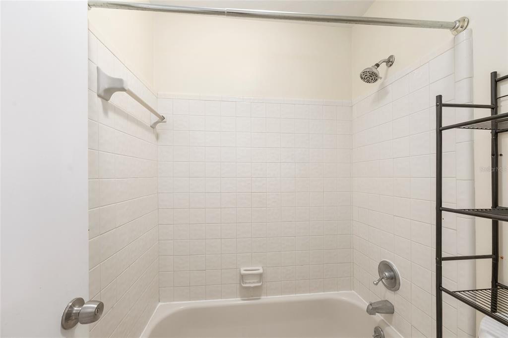 345 Northwest 48th Boulevard, Unit K Gainesville, FL 32607 - Photo 39 of 50 a bathroom with a bathtub