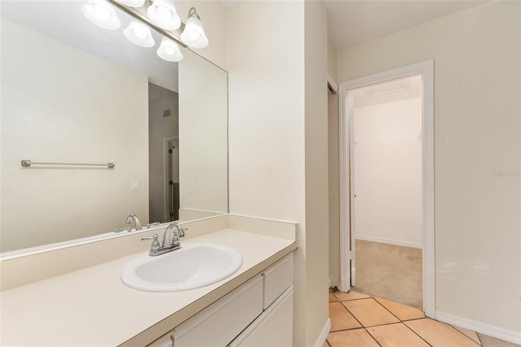 345 Northwest 48th Boulevard, Unit K Gainesville, FL 32607 - Photo 40 of 50 a bathroom with a sink and a mirror