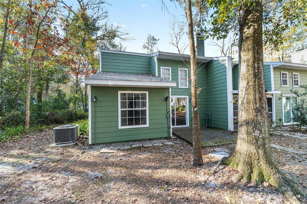 345 Northwest 48th Boulevard, Unit K Gainesville, FL 32607 - Photo 46 of 50 a view of a house with backyard