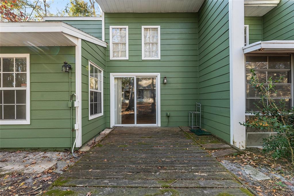 345 Northwest 48th Boulevard, Unit K Gainesville, FL 32607 - Photo 49 of 50 a front view of a house with a garden