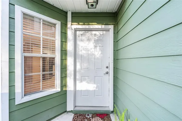 a view of a door and a window