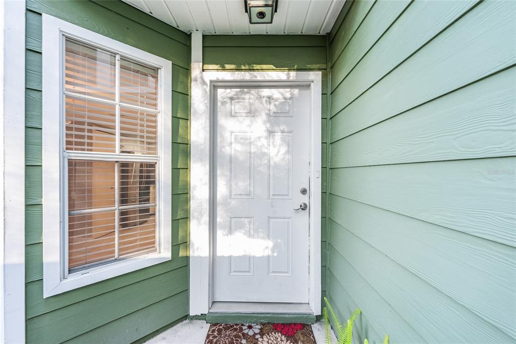 345 Northwest 48th Boulevard, Unit K Gainesville, FL 32607 - Photo 7 of 50 a view of a door and a window