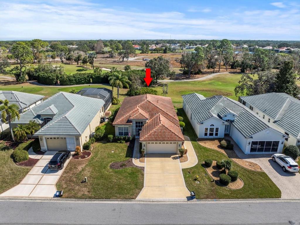 9089 Penelope Drive Weeki Wachee, FL 34613 - Photo 1 of 1 an aerial view of a house with garden space and ocean view