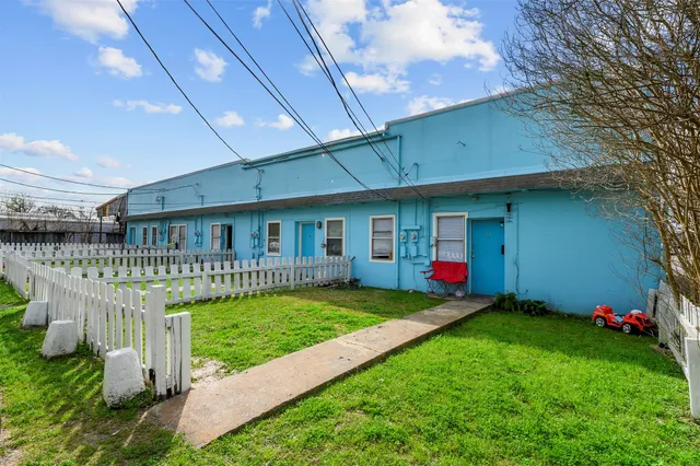 a front view of a house with a yard and porch