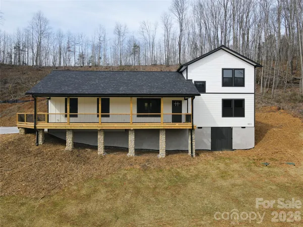 a front view of a house with large windows