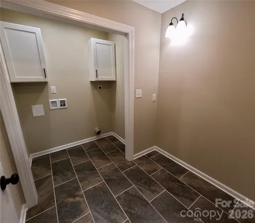 a bathroom with a window and a shower