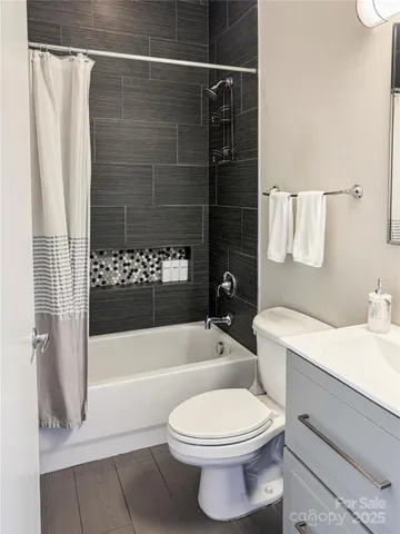 a bathroom with a toilet a sink and bathtub