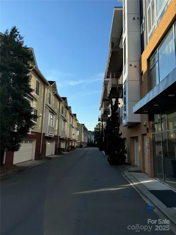 a couple of cars parked in front of a house