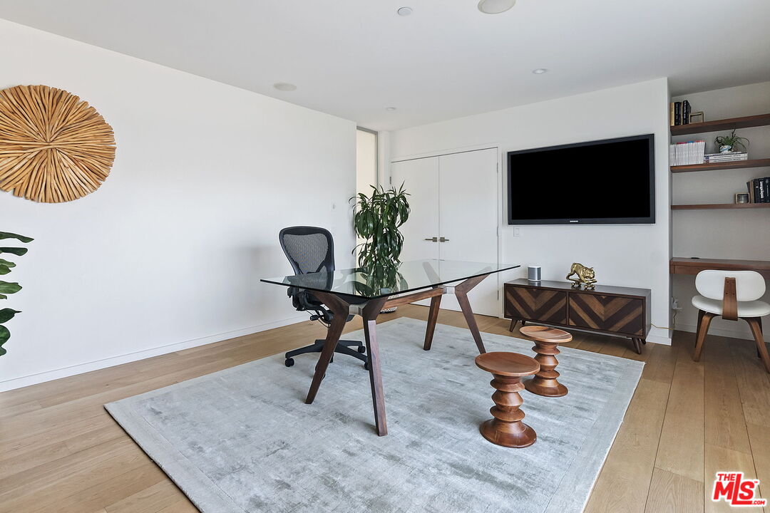 1220 Cabrillo Avenue Venice, CA 90291 - Photo 12 of 26 a living room with furniture and a flat screen tv